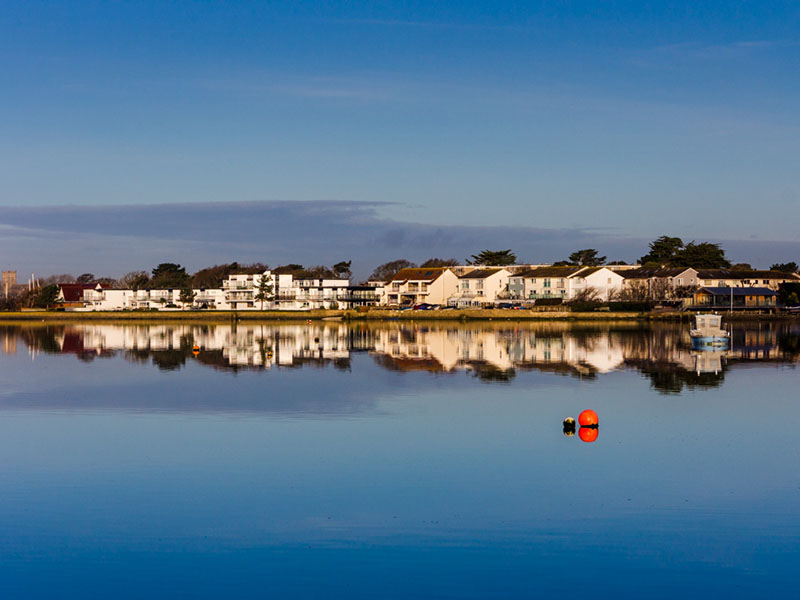serene view of water and houses